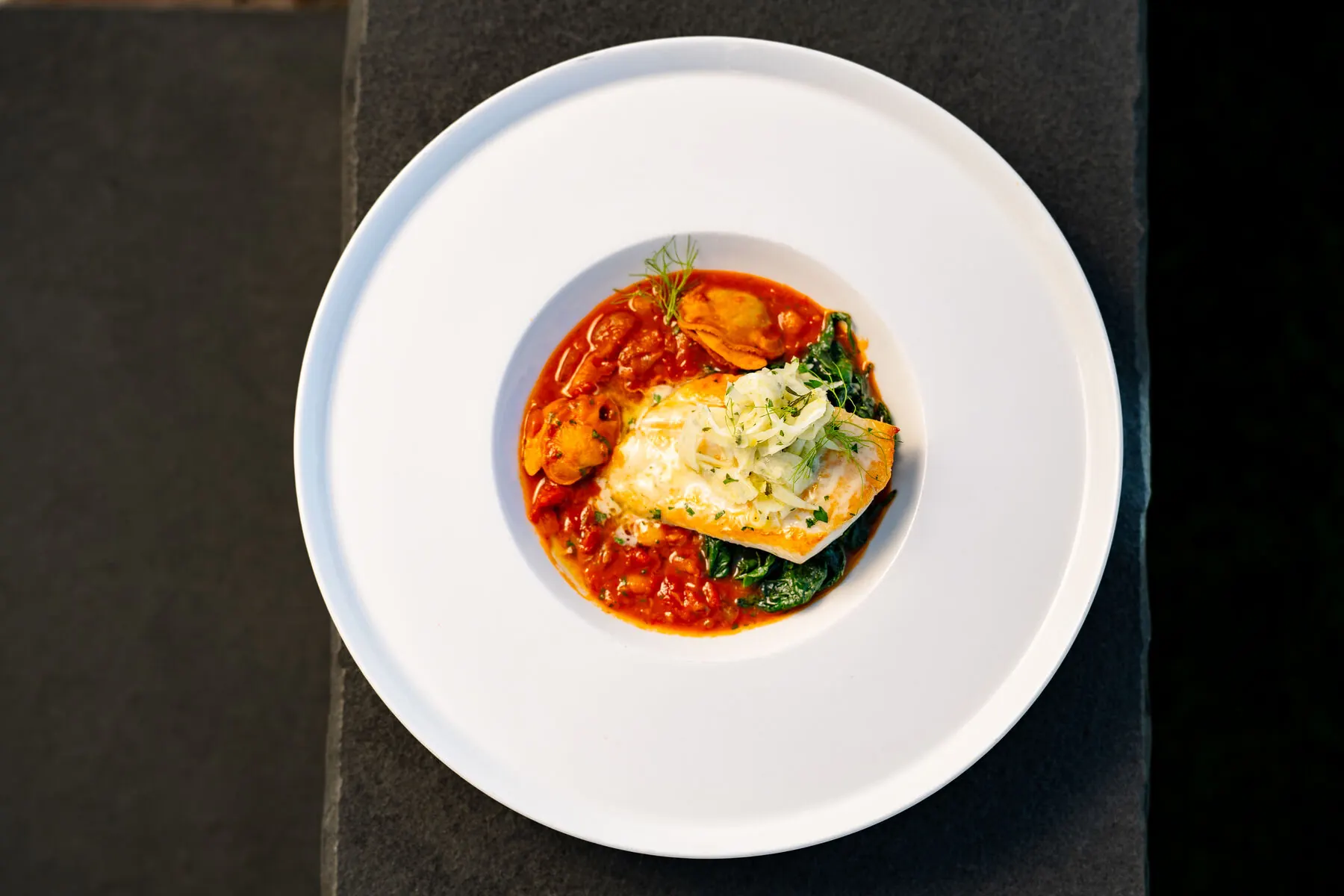 Plated fish dish at Huntington Crescent Club