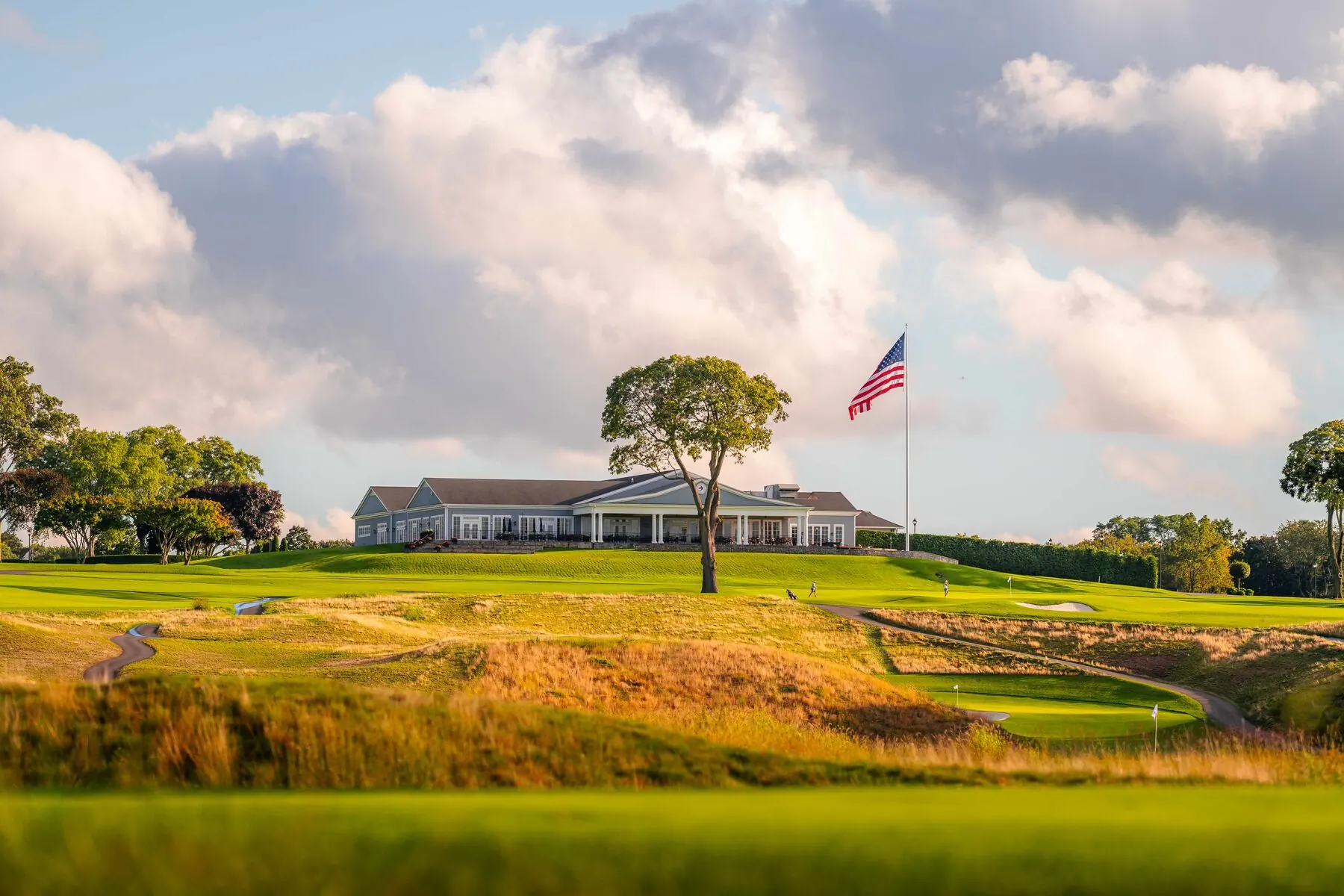 Huntington Crescent Club clubhouse and flag at golden hour